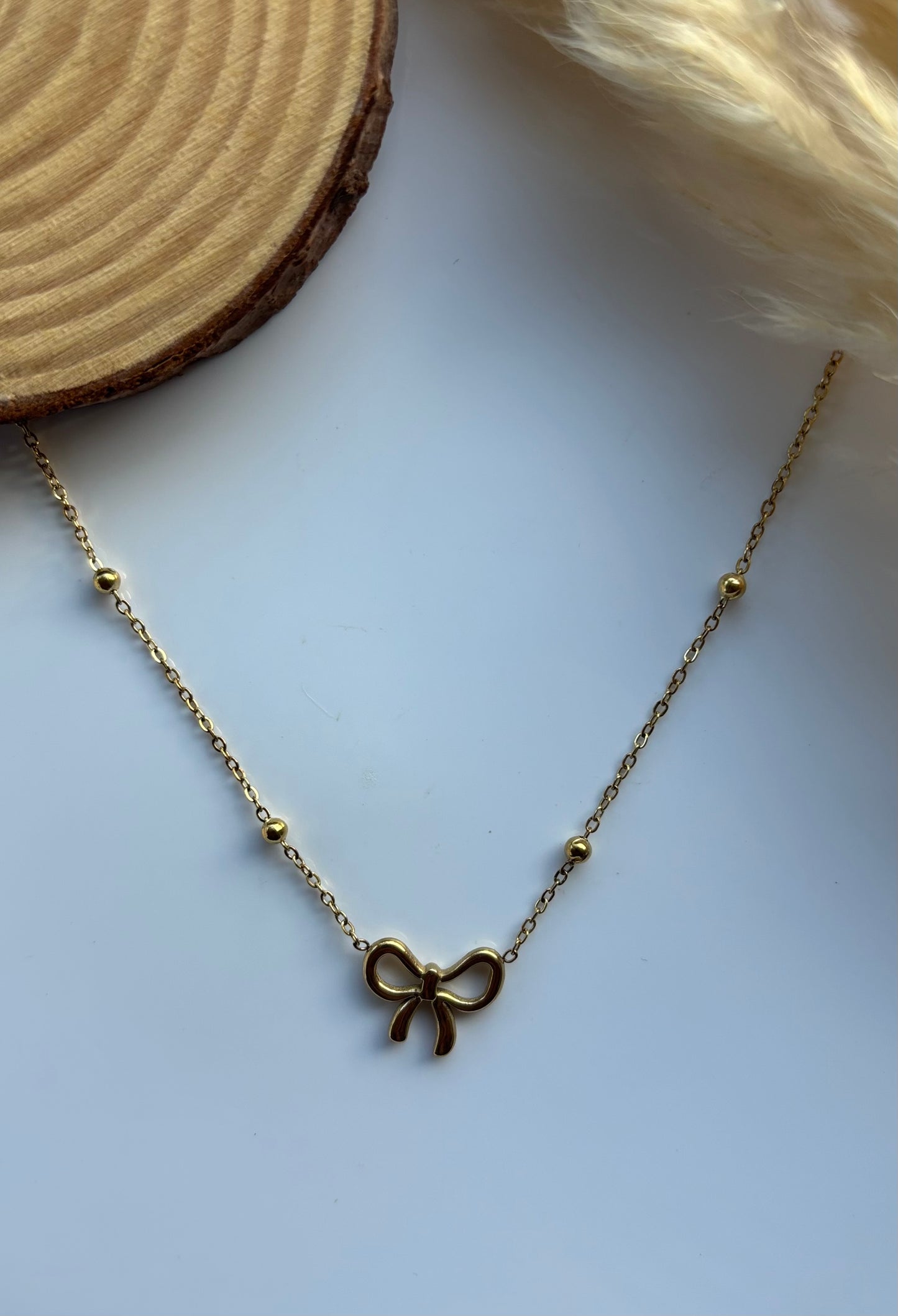 Anti tarnish gold plated bow pendent
