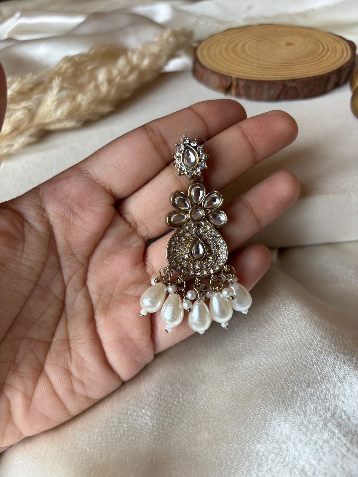 White jumka earrings